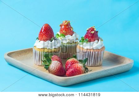 Strawberry Cupcak Topping With Pistachio And Cream,selective Focus