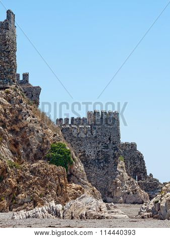 Ruined medieval fortress wall against sky. Maumere fortress and sea near Anamur Turkey