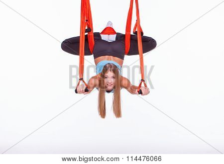 Young Woman Doing Anti-gravity Aerial Yoga In Hammock