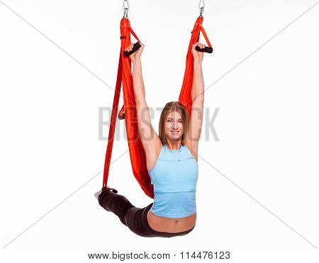 Young Woman Doing Anti-gravity Aerial Yoga In Hammock