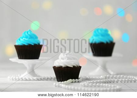 Chocolate cupcakes on blurred background