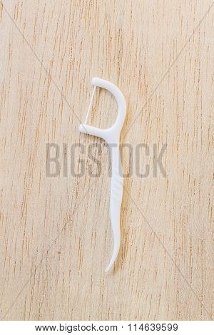 Oral Device : A box of white dental flossers on wooden background