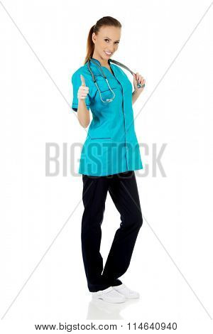 Woman doctor with thumbs up.