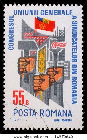 ROMANIA - CIRCA 1971: a stamp printed in Romania shows Trade Union Congress  Fists with hammer, ear and torch, circa 1971.