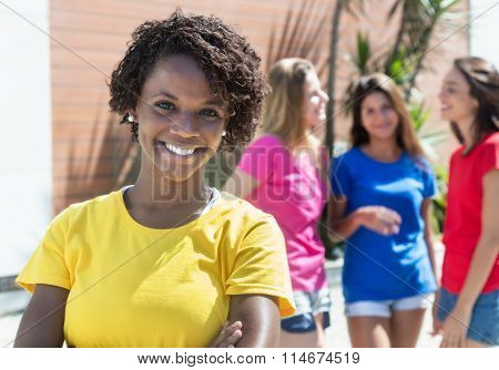 Laughing African Woman With Three Girlfriends In The City