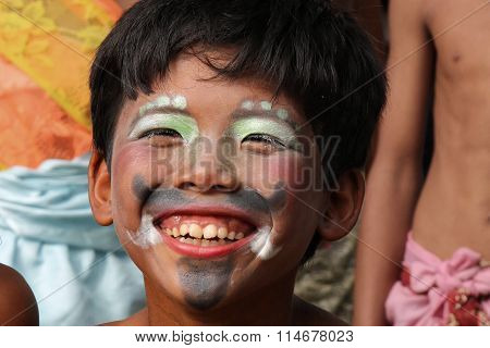 Boy Plays During A Traditional Festival