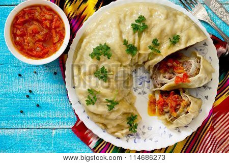 Khanum - A Traditional Uzbek Dish. Roll Lazy Dumplings With Meat, Potatoes And Onions.