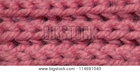 Red fabric texture with stitched hooks. Fabric texture for the background. Closeup