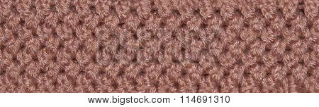 Red and orange texture animal fur sewn crochet with fibers and hair. Closeup