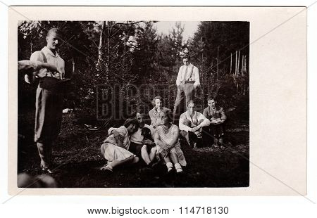 Boys with girls in nature. Vintage photo