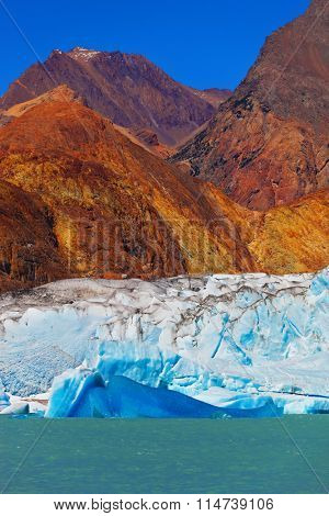  Excursion by boat to the huge blue-white glacier. Unique lake Viedma in Argentine Patagonia. The lake is surrounded by mountains