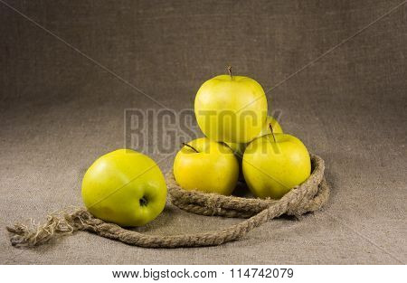 yellow apples on a table