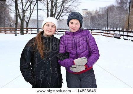 Two Teenager Girl On The Snowy White Background