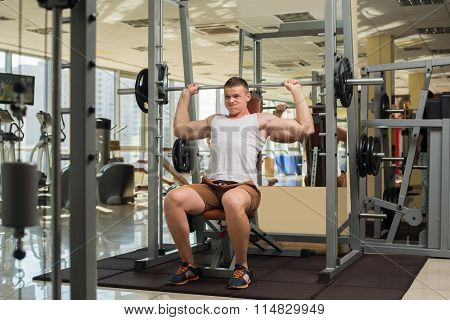 Strong guy with barbell.