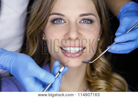 Dentist examining a patient's teeth in the dentist.