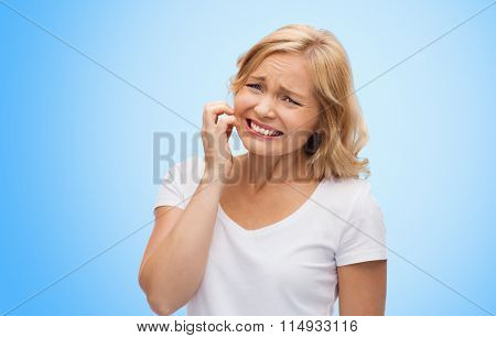 unhappy woman suffering from face inch