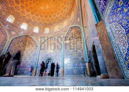 Tourists Inside Fantastic Designed Mosque With Tiled Dome And Walls In Isfahan