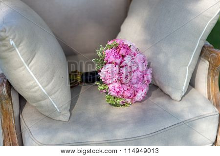 Wedding bouquet of peonies, on a beautiful chair 3