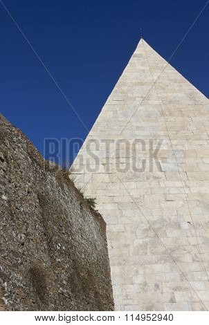 Pyramid Of Celsius And Roman Ancient Wall