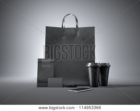 Set of shopping bag, two coffee cups, blank business cards and generic design smartphone. Black back