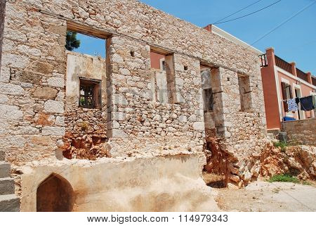 A derelict old stone building at Emborio on the Greek island of Halki. The village has a number of abandoned old buildings.