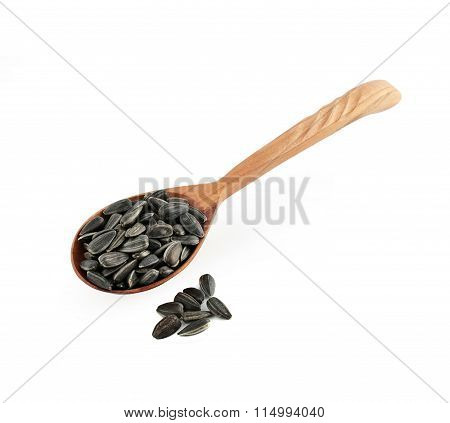 Sunflower seeds with wooden spoon