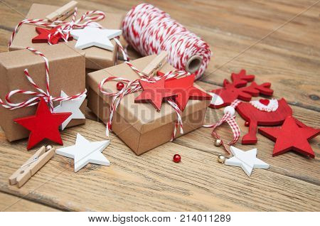 Christmas gift boxes and decorations on wooden background