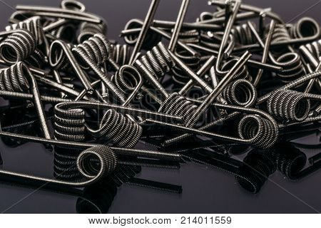 Group of Fussed Clapton Coils for vape or e-cig dripping atomizers or RDA, accessories for vaping, macro photo