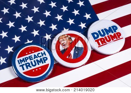 LONDON UK - NOVEMBER 15TH 2017: Anti-Tump badges over an American flag background on 15th November 2017.