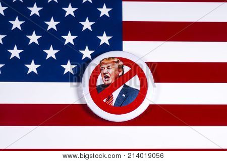 LONDON UK - NOVEMBER 15TH 2017: Anti-Tump badge over an American flag background on 15th November 2017.