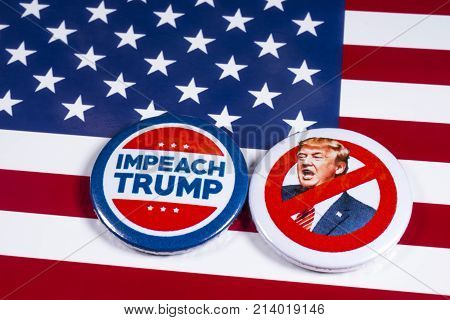 LONDON UK - NOVEMBER 15TH 2017: Anti-Tump badges over an American flag background on 15th November 2017.