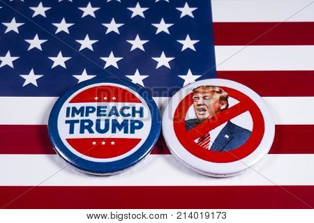 LONDON UK - NOVEMBER 15TH 2017: Anti-Tump badges over an American flag background on 15th November 2017.