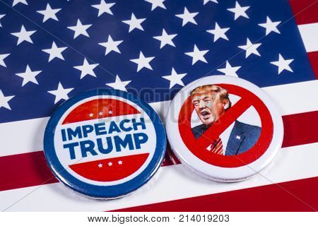LONDON UK - NOVEMBER 15TH 2017: Anti-Tump badges over an American flag background on 15th November 2017.