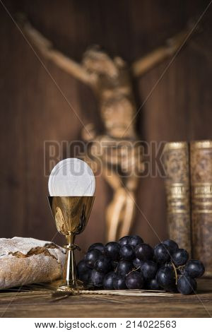 Eucharist symbol of bread and wine, chalice and host, First communion background