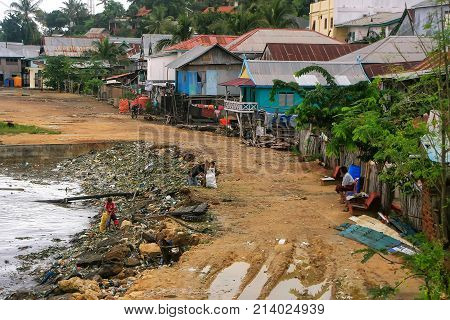 LABUAN BAJO INDONESIA-MARCH 17: Pile of garbage in the sea on March 172012 in Labuan Bajo Flores Indonesia. The local economy is centered around the ferry port and tourism.