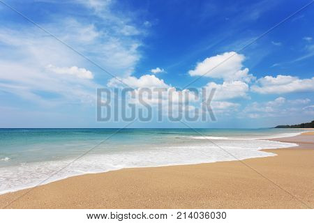 tropical andaman seascape scenic off sandy beach phuket thailand with wave crashing on sandy shore