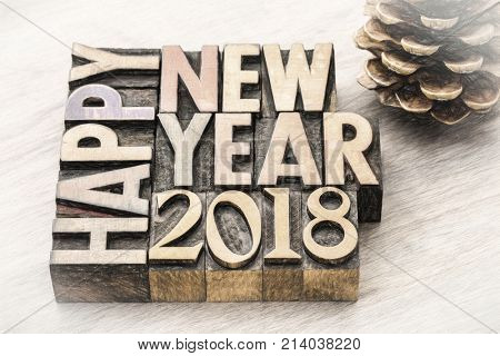 Happy New Year 2018 greeting card - text in vintage letterpress wood type blocks, charco painting digital effect