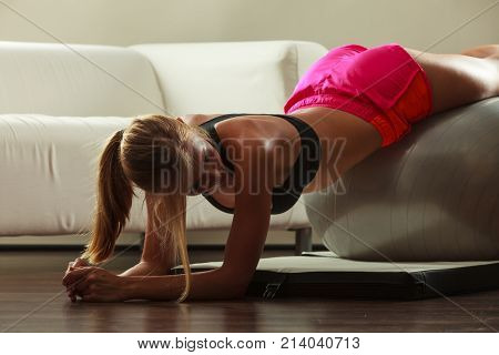 Woman Doing Fitness Exercises With Fit Ball
