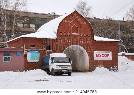 NIZHNY NOVGOROD, RUSSIA - NOVEMBER 07, 2016: Main entrance (back view) of the Red (Bugrovsky) cemetery at winter. The cemetery was planned at the turn of the 1880s-90s.