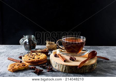 Cup Of  Tea, Biscuits, Cinnamon, Anise On Dark   Background