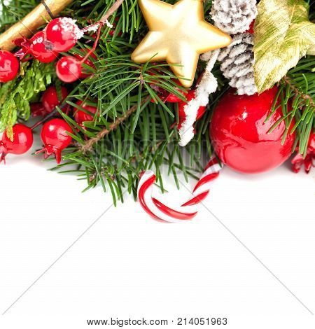 Bright Christmas Background with Xmas Decoration Green Xmas Tree Twig Golden Star and Red Christmas Balls on White Background
