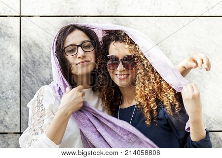 Couple Of Pretty Young Woman In The Center Of A Capital City
