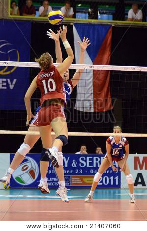BUDAPEST, HUNGARY - JUNE 17: Dora Horvath (in red 10) in action at a CEV European League woman's volleyball game Hungary vs Czech Republic on June 17, 2011 in Budapest, Hungary.