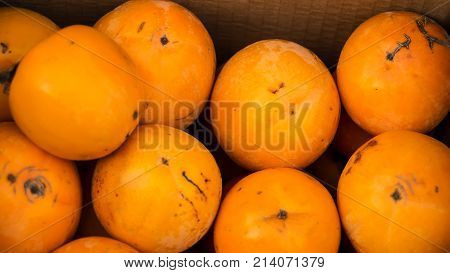 Orange juicy persimmon in the bazaar in the city of Baku