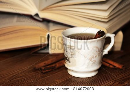 A Cup Of Coffee, Cinnamon Sticks And Old Books