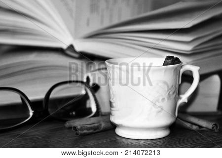 A Cup Of Coffee, Cinnamon Sticks And Old Books