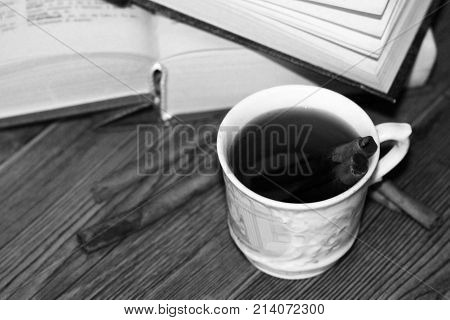 A Cup Of Coffee, Cinnamon Sticks And Old Books