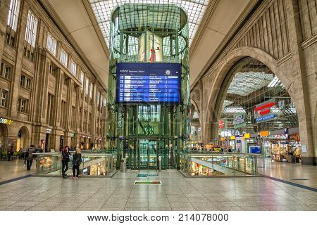 LEIPZIG, GERMANY - MAY 29, 2014:  Interior of the Leipzig Central Station with shops and passengers. Wide-angle view.
