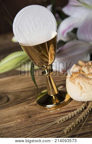 Eucharist symbol of bread and wine, chalice and host, First communion background