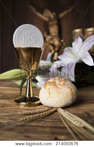 Eucharist symbol of bread and wine, chalice and host, First communion background